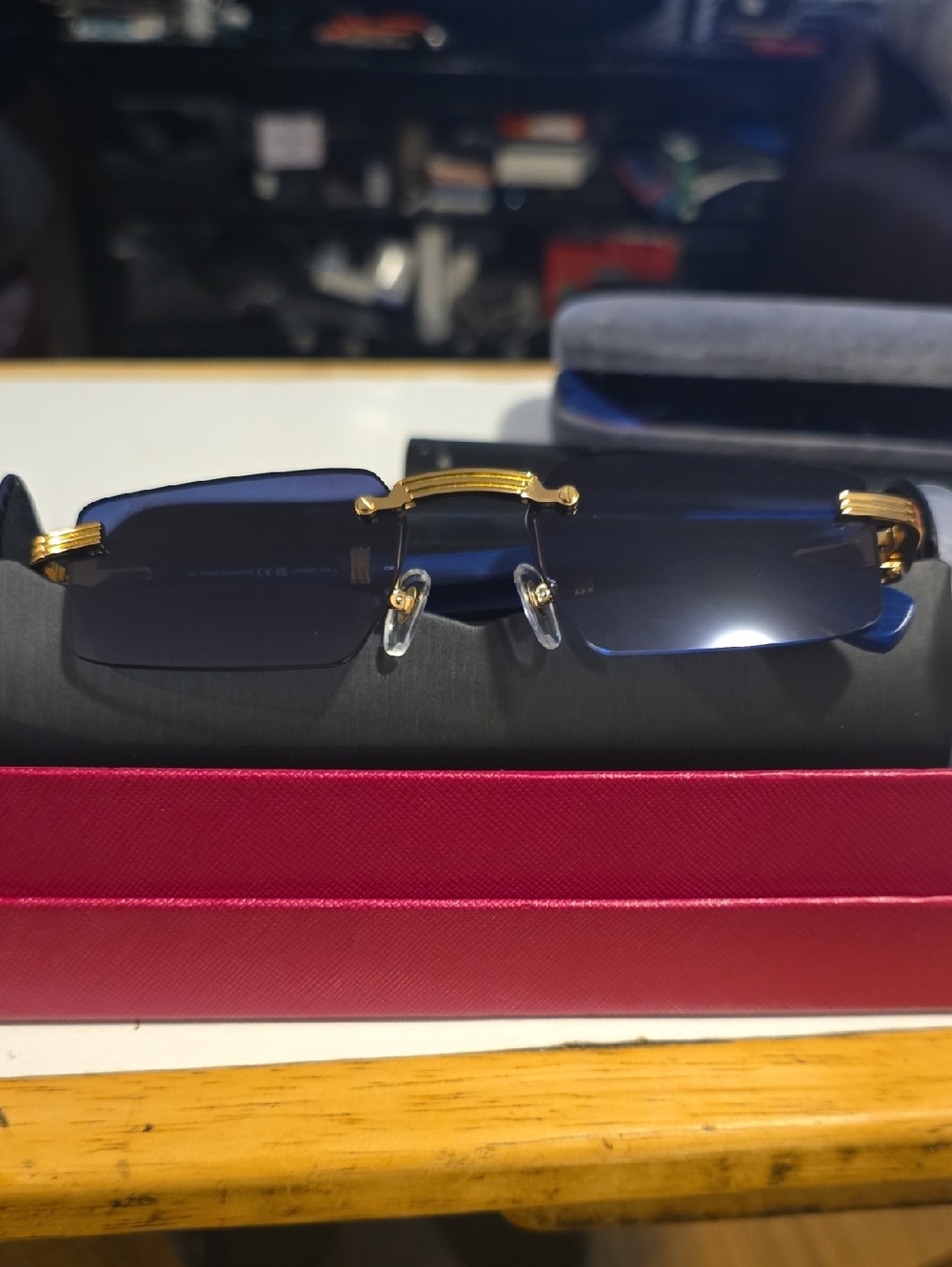 Rimless Blue Lens Sunglasses with Gold Accents